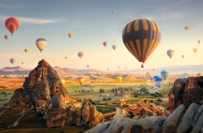 hot-air-balloons-flying-at-sunset-cappadocia-turkey-picture-id1164258121